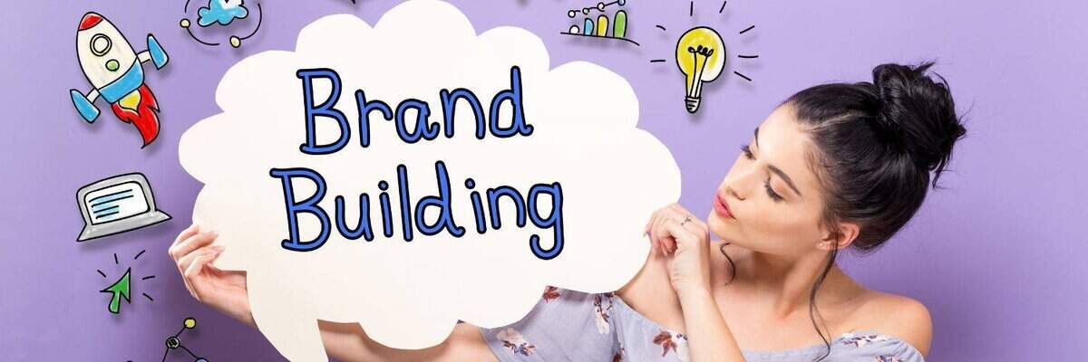 Woman holding a white speech bubble sign that says 'Brand Building' against a purple background, surrounded by colorful cartoon-style icons like a rocket, lightbulb, and graphs.