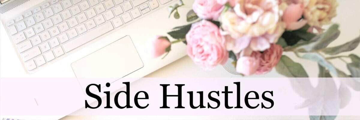Flat lay of a white laptop keyboard and a bouquet of pink and cream flowers with the words 'Side Hustles' in bold black text across a light pink banner