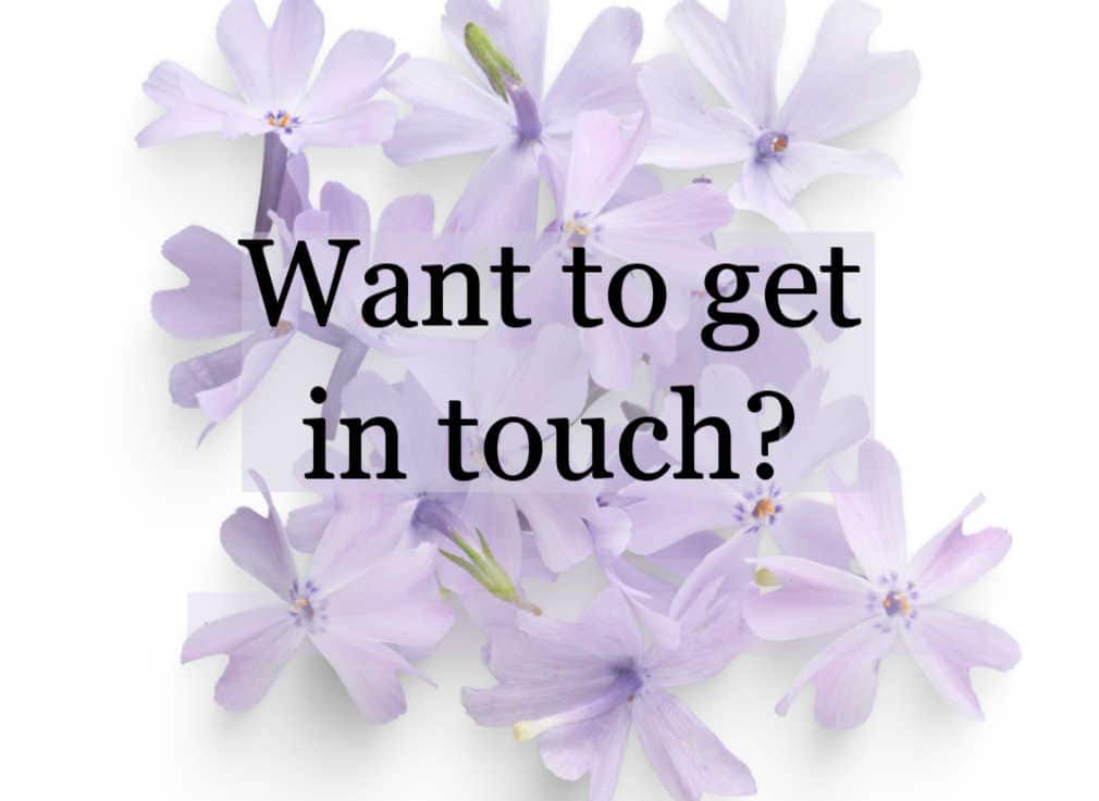 Soft lavender flowers with a translucent banner overlay and the text “Want to get in touch?” displayed in the center.
